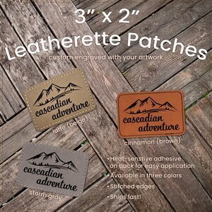 May include: Three rectangular leatherette patches, each 3" x 2", with the text "Cascadian Adventure" and a mountain graphic. Colors include beige, brown, and gray. The patches have stitched edges and heat-sensitive adhesive.