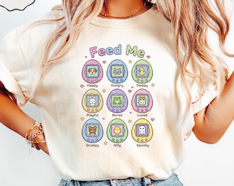 Feed Me Virtual Pet T-Shirt, Kawaii Pixel Art Animals, Retro 90s Digital Pet Tee, Cute Gaming Nostalgia Shirt, Playful Character Design
