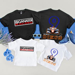 May include: Black and white t-shirts with the text "CHIP GANASSI RACING" and a racing car graphic. A white t-shirt with the same text and a racing car graphic. A black t-shirt with the number 9 and the name "SCOTT DIXON".