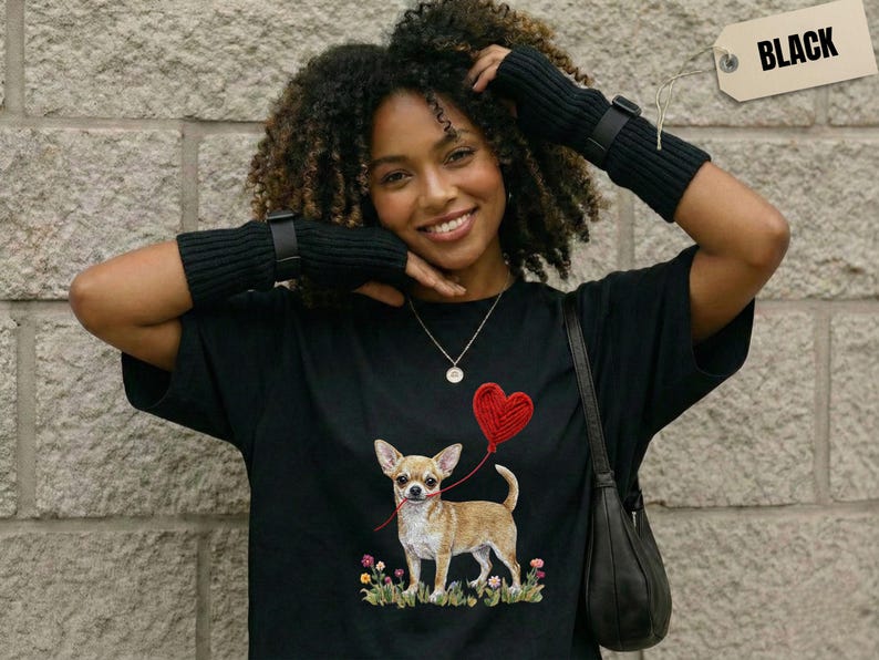 Faux Yarn Chihuahua shirt, puppy love shirt, yarn heart balloon, valentine dog tee style for tiny-dog fans. A cute Chihuahua with big ears holding a red yarn heart balloon string, finished with soft floral details for everyday wear.