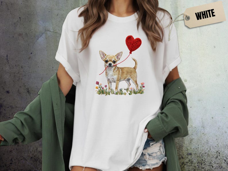 Faux Yarn Chihuahua shirt, puppy love shirt, yarn heart balloon, valentine dog tee style for tiny-dog fans. A cute Chihuahua with big ears holding a red yarn heart balloon string, finished with soft floral details for everyday wear.