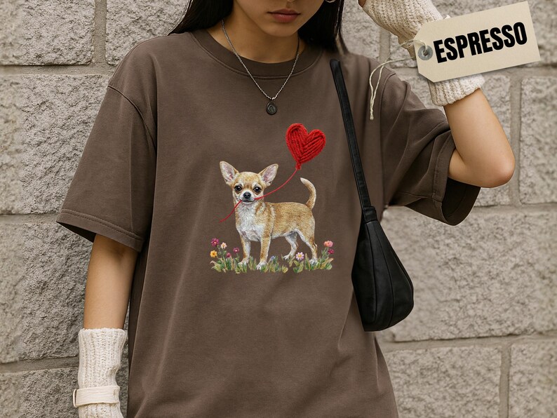 Faux Yarn Chihuahua shirt, puppy love shirt, yarn heart balloon, valentine dog tee style for tiny-dog fans. A cute Chihuahua with big ears holding a red yarn heart balloon string, finished with soft floral details for everyday wear.