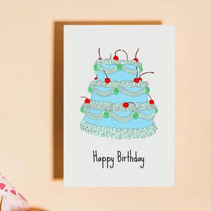 Carte d'anniversaire gâteau kitsch, bleue