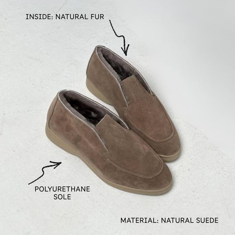 May include: A pair of taupe slip-on shoes crafted from natural suede. The shoes feature a natural fur lining on the inside and a polyurethane sole. Text on the image indicates the materials as natural suede, natural fur, and polyurethane sole.