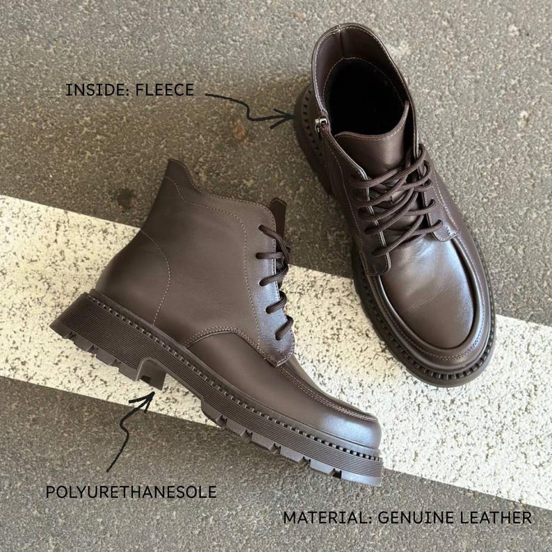 May include: Brown leather boots with a polyurethane sole and fleece lining. The boots have a lace-up design and a zipper on the side. The text on the image says "MATERIAL: GENUINE LEATHER" and "INSIDE: FLEECE".