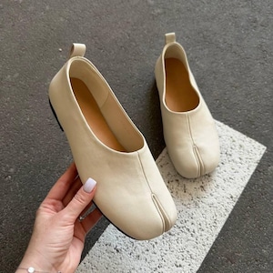 Women's split-toe milk leather tabi ballet flats with soft sole and minimalist barefoot design, ideal for fall casual wear