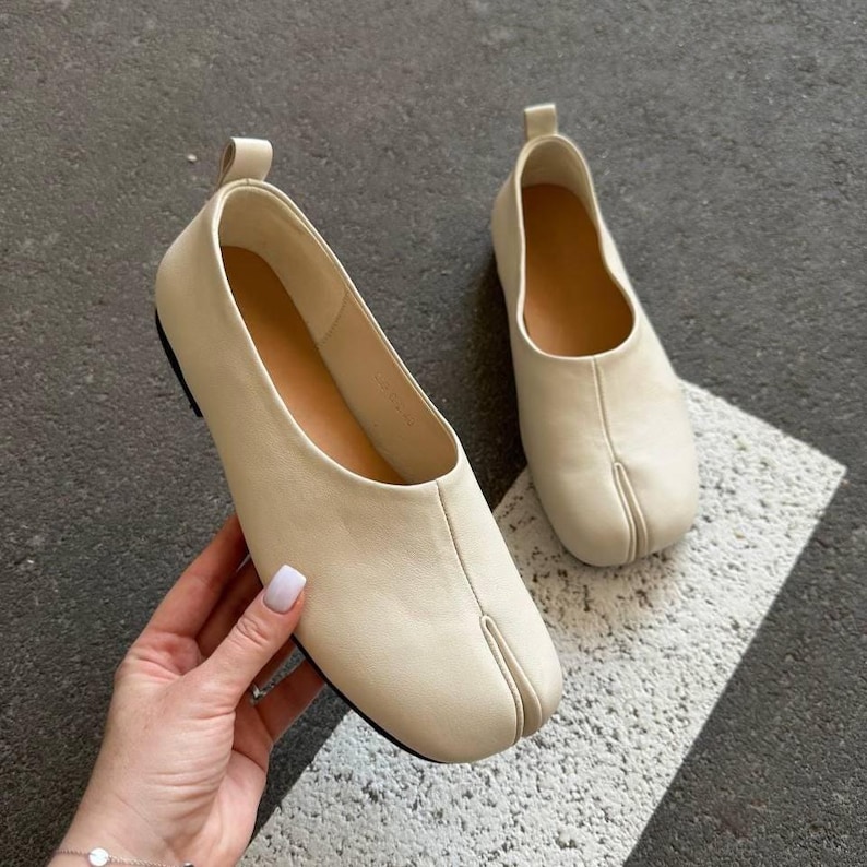 Women's split-toe milk leather tabi ballet flats with soft sole and minimalist barefoot design, ideal for fall casual wear