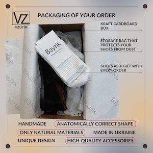 May include: A kraft cardboard box containing a pair of shoes, white socks, and tissue paper. The box is labeled "Packaging of Your Order" and includes text that reads "Handmade", "Anatomically Correct Shape", and "Only Natural Materials".