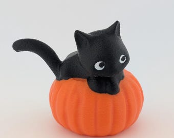 Adorable Black Cat in a Pumpkin Figurine