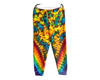May include: Tie-dye sweatpants with a colorful swirl pattern in shades of yellow, orange, red, blue, and purple.