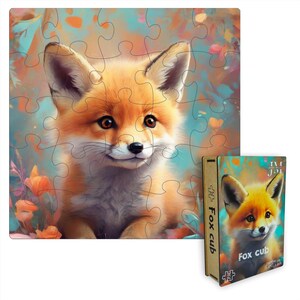 May include: A wooden jigsaw puzzle featuring a cute fox cub with orange fur and brown eyes. The puzzle is set against a colorful background of blue, green, and orange. The box for the puzzle is also shown, with the title "Fox Cub" printed on it.