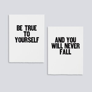May include: Two white cards with black text. The first card says "Be true to yourself". The second card says "And you will never fall".