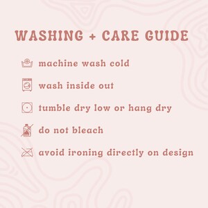 May include: A pink background with a cream-colored, abstract design. The text "WASHING + CARE GUIDE" is at the top. Instructions include machine wash cold, wash inside out, tumble dry low or hang dry, do not bleach, and avoid ironing directly on design.