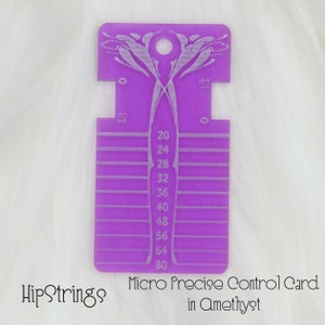 May include: A purple acrylic Micro Precise Control Card featuring etched measurement markings and numbers ranging from 20 to 80. The tool includes a circular hole at the top, symmetrical side cutouts, and the text HipStrings Micro Precise Control Card in Amethyst.