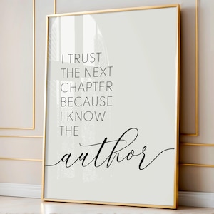 May include: A framed print with a gold border and a white background. The black text reads, "I trust the next chapter because I know the author." The artwork is a motivational quote.