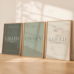 May include: Three framed prints with the words "CALLED", "CHOSEN", and "LOVED". Each print has a neutral background and a wooden frame. The text is in a simple, elegant font, with a minimalist design.