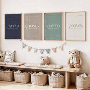 May include: Four framed art prints with the words "CALLED", "CHOSEN", "LOVED", and "KNOWN" in white text. The prints are in navy, taupe, sage green, and off-white. Below, a wooden bench with storage baskets and soft toys.