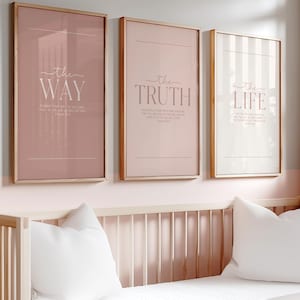 May include: Three framed art prints with inspirational text. The first print is a dusty rose color with the words "the WAY". The second print is a light pink color with the words "the TRUTH". The third print is white with pink stripes and the words "the LIFE".