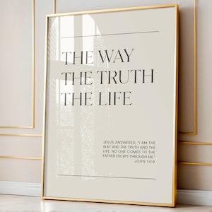 May include: A framed print with the words "THE WAY THE TRUTH THE LIFE" in a serif font. Below the text is a quote from John 14:6. The frame is gold, and the background is a light beige color.