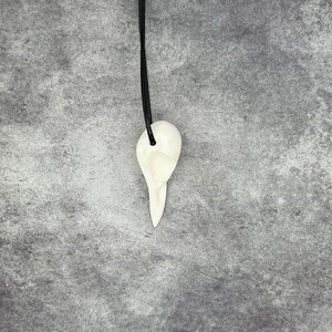 Side view of Ginger Snaps Movie Bird Skull Necklace Crow Pendant - Goth Gingersnaps Gift Dark Tower Faux Taxidermy Bone Jewelry Bones Necklace Viking