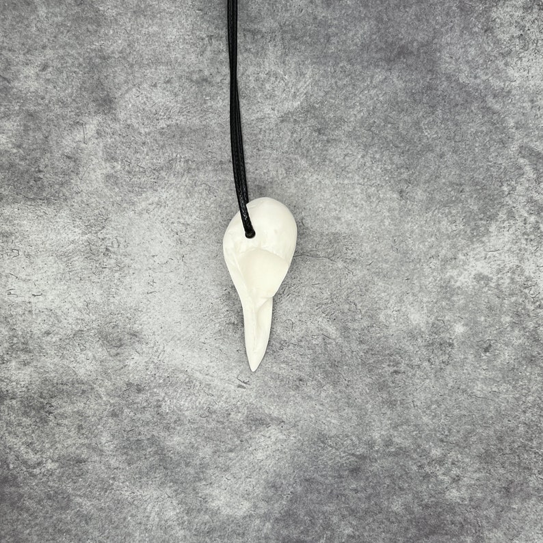 Side view of Ginger Snaps Movie Bird Skull Necklace Crow Pendant - Goth Gingersnaps Gift Dark Tower Faux Taxidermy Bone Jewelry Bones Necklace Viking