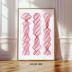 May include: Abstract art print featuring three red, swirling, organic shapes against a white background. The print is framed in a gold frame.