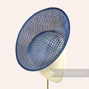 May include: A set of three ceramic nesting bowls in shades of blue, green, and white. The bowls feature a speckled glaze and a simple, modern design. The largest bowl measures approximately 8 inches in diameter.