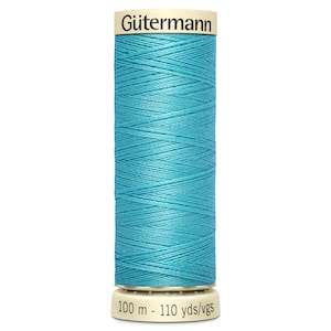 May include: A spool of Gütermann thread in a bright turquoise blue color. The spool is labeled with the brand name and the length of the thread: 100 m - 110 yds/vgs.