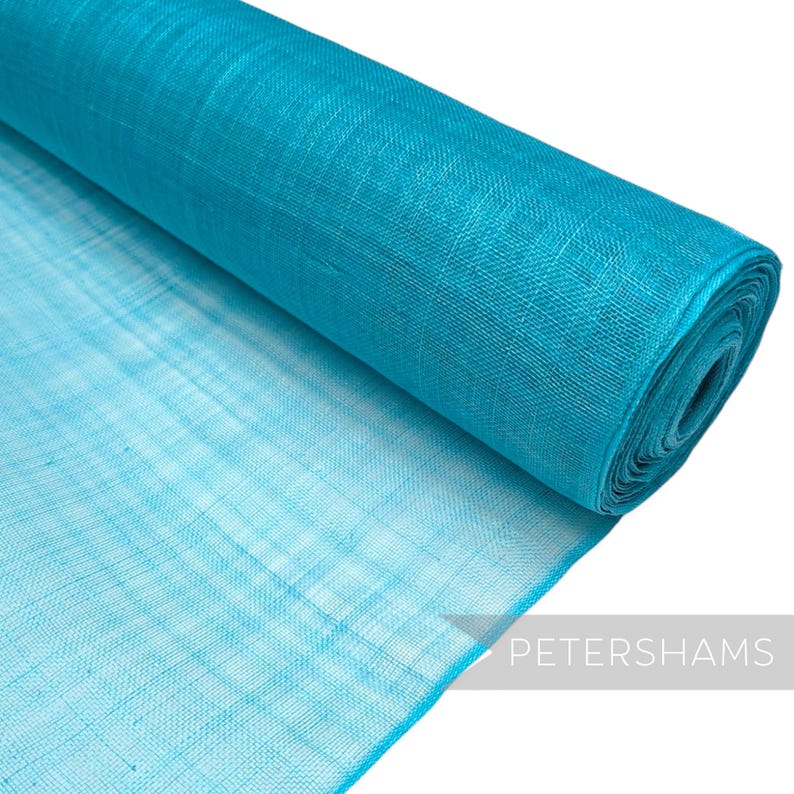 May include: A roll of turquoise blue mesh fabric. The fabric is lightweight and has a delicate texture.