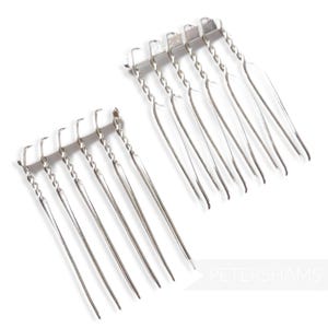 May include: Two rows of silver hair combs with a twisted wire design. Each comb has seven tines.