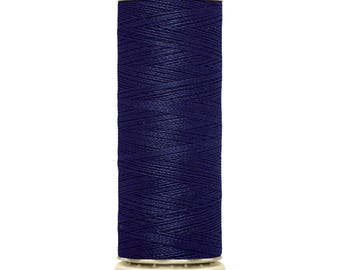 May include: A spool of dark blue Gütermann sewing thread. The label reads "Gütermann" at the top and "100 m - 110 yds/vgs" at the bottom. The thread is tightly wound on a white plastic spool.
