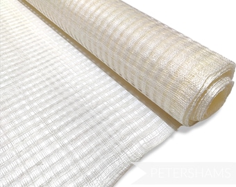 May include: A roll of white, sheer, decorative mesh with a grid pattern. The mesh is rolled up and the end is visible.