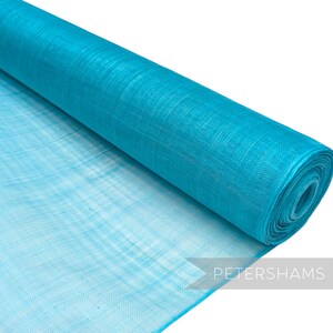 May include: A roll of turquoise blue mesh fabric. The fabric is sheer and has a slightly iridescent sheen.
