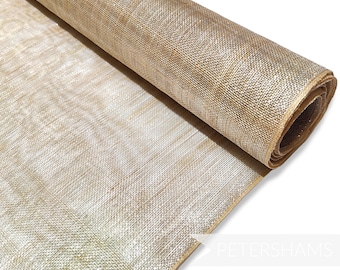 May include: A roll of gold metallic mesh fabric. The fabric has a subtle shimmer and is ideal for crafting and decorating.