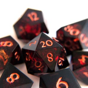 Succubus' Kiss - black dice with red core, resin epoxy dice, rpg dnd dice