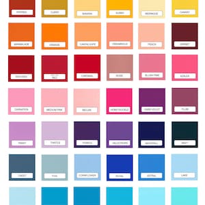 May include: A colour chart titled "Solid Fabrics" displays a variety of fabric swatches in a grid. Colours range from black and white to vibrant hues like turquoise and red, with each swatch labelled with its colour name.