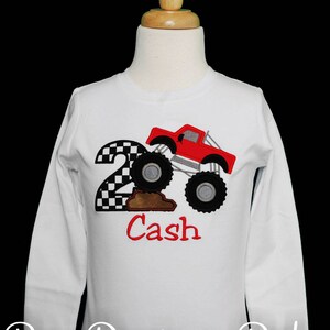 Personalized monster truck birthday shirt. Custom monster truck birthday shirt. Appliqued, embroidered monster truck birthday shirt. Monster truck climbing dirt. Monster truck number shirt.