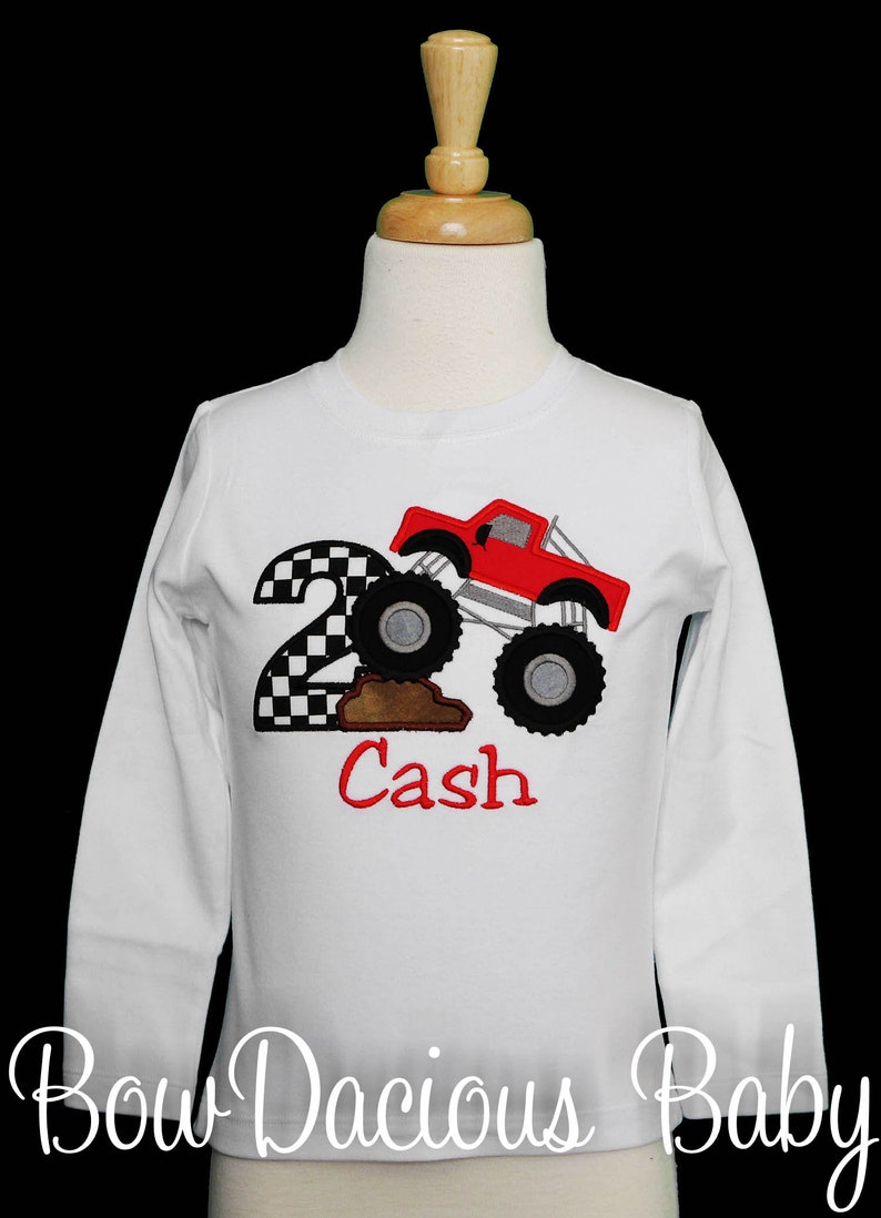 Personalized monster truck birthday shirt. Custom monster truck birthday shirt. Appliqued, embroidered monster truck birthday shirt. Monster truck climbing dirt. Monster truck number shirt.