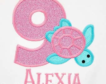 May include: Pink glitter number nine with a turquoise sea turtle applique and the name Alexia embroidered in pink.
