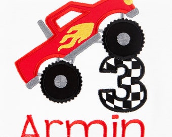 May include: Red monster truck with a yellow flame design, driving over a black and white checkered number three. The name Armin is written in red below the truck.