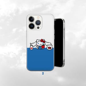 May include: A white and blue phone case featuring a cartoon character with a red bow, holding an apple and a plate of food. The case has a blue lower half and the number "2" at the bottom.