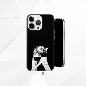 May include: Black phone case featuring a monochrome illustration of a woman with long hair and a cat. The case has a glossy finish and the number "3" is printed at the bottom.