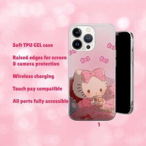 May include: A clear phone case featuring a pink Hello Kitty design. The case has raised edges for screen and camera protection, is wireless charging compatible, and touch pay compatible. The text on the case reads: Soft TPU GEL case, Wireless charging, Touch pay compatible.