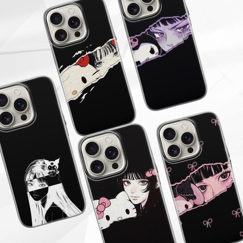 May include: Black phone cases with anime-style illustrations. The cases feature various designs, including a girl with long hair, a Hello Kitty character, and other manga-inspired artwork. The cases have a glossy finish.