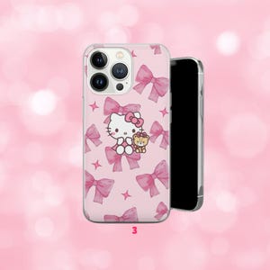 May include: Pink phone case featuring a repeating pattern of pink bows and stars. The case has a graphic of Hello Kitty holding a teddy bear. The number "3" is printed at the bottom of the case.