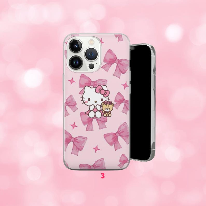 May include: Pink phone case featuring a repeating pattern of pink bows and stars. The case has a graphic of Hello Kitty holding a teddy bear. The number "3" is printed at the bottom of the case.
