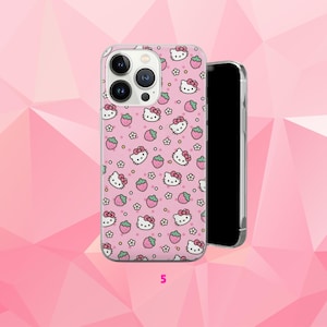 May include: Pink phone case featuring a repeating pattern of Hello Kitty faces, strawberries, and flowers. The case is on a pink background with a geometric design. The number "5" is visible at the bottom.