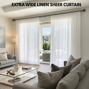 May include: White extra wide linen sheer curtains in a living room. The curtains are draped, allowing natural light to filter through. The text "EXTRA WIDE LINEN SHEER CURTAIN" is at the top. The curtains hang on a dark brown rod.