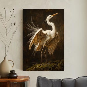 May include: A framed art print of a white egret with outstretched wings. The bird has long, slender legs and a long, pointed beak. The background is a dark, moody landscape. The artwork is a vintage-style painting.