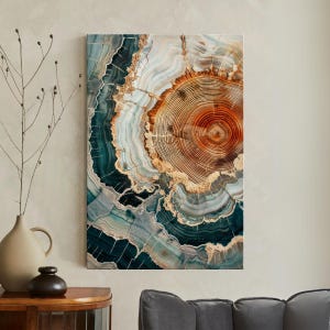 May include: A rectangular wall art print depicting a tree trunk cross-section. The artwork displays concentric rings in brown, orange, teal, and white, forming a natural, abstract pattern. The print has a polished, glossy finish.